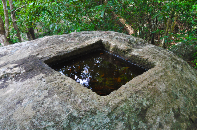 Stone oil lamp carved in rock at Ritigala monastery
